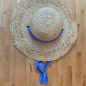 Straw boater hat with cornflower blue ribbon